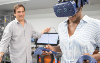 Associate professor Kim Grinfeder explores interactive media technologies with student Chelsea Lovell. Photo: Mariano Copello for the University of Miami