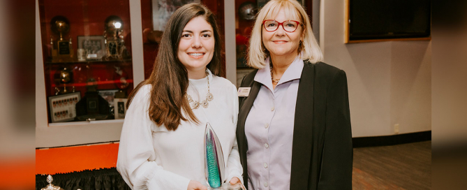 Julia Lynch, left, holds the Julia Burke Award for Character and Excellence. Photo courtesy of Julia Lynch.