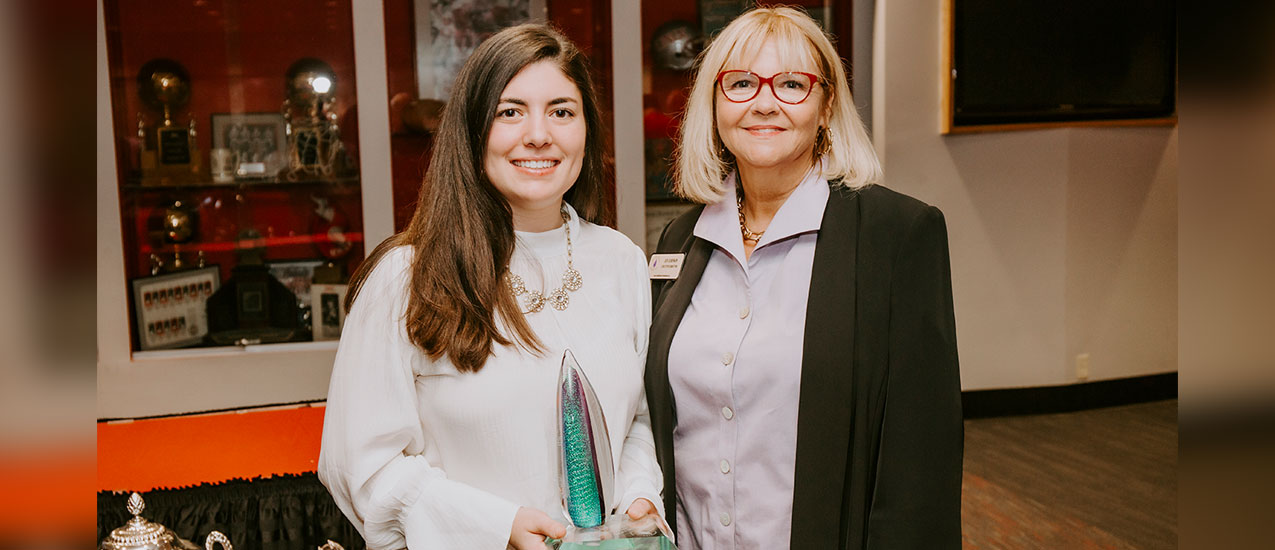 Julia Lynch, left, holds the Julia Burke Award for Character and Excellence. Photo courtesy of Julia Lynch.