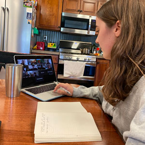 The Miami Hurricane's managing editor Anna Timmons virtually meets with staff and faculty advisor Tsitsi Wakhisi as she sits at her kitchen table. Photo: Anna Timmons/University of Miami