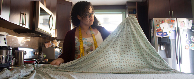 Lorena Lopez measures fabric for face masks to prevent the spread of COVID-19. Photo courtesy of Lorena Lopez.