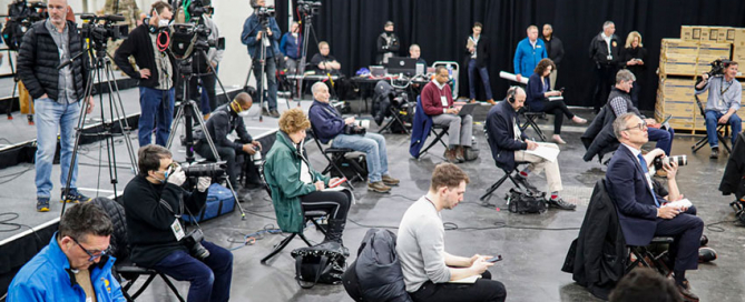 Journalists practice social distancing during a news conference with New York Gov. Andrew Cuomo on March 24. Photo: Associated Press