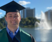 Ben Ezzy dons his graduation cap for a photo on the Coral Gables campus. Photo courtesy of Ben Ezzy.