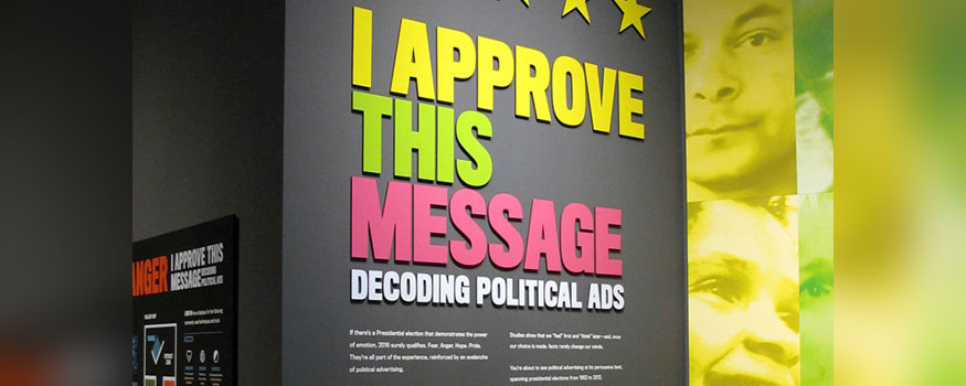 In this July 28, 2016 photo, a sign explains an exhibit on political campaign ads at the Toledo Museum in Toledo, Ohio. Photo: Associated Press