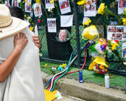 People embrace at a makeshift memorial outside St. Joseph Catholic Church in Surfside on Monday, June 28. Photo: The Associated Press