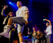 Katarina Jenkins ( in the #18 Jersey) on stage with Flo Rida during an HP concert. Photo courtesy of Katarina Jenkins.