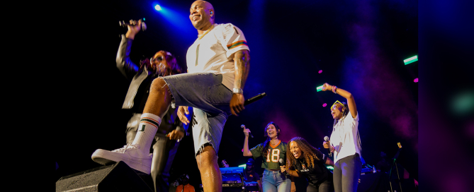 Katarina Jenkins ( in the #18 Jersey) on stage with Flo Rida during an HP concert. Photo courtesy of Katarina Jenkins.