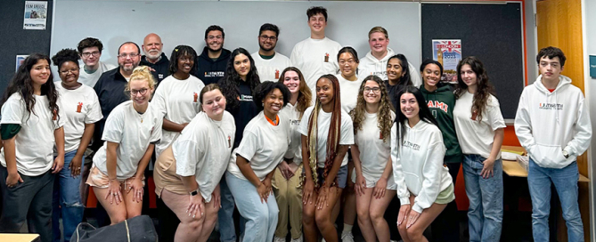 Students who took part in the first Miami Oceans Debate held at the School of Communication pose for a group photo.