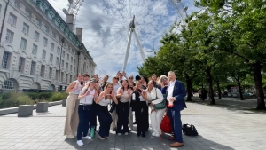 The 2023 London study abroad group poses in front of the London Eye.