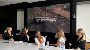 Students take in a presentation at the Wall Street Journal.