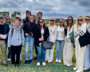 Students taking part in the three week Global Communication, London Summer study abroad program pose in front of Stonehenge.