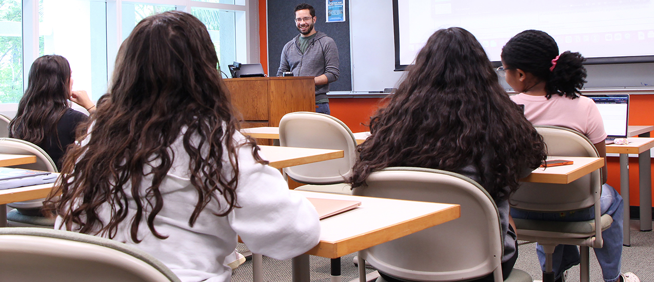 Associate Professor Nicholas Carcioppolo teaches a class to students in the Communication Studies program.